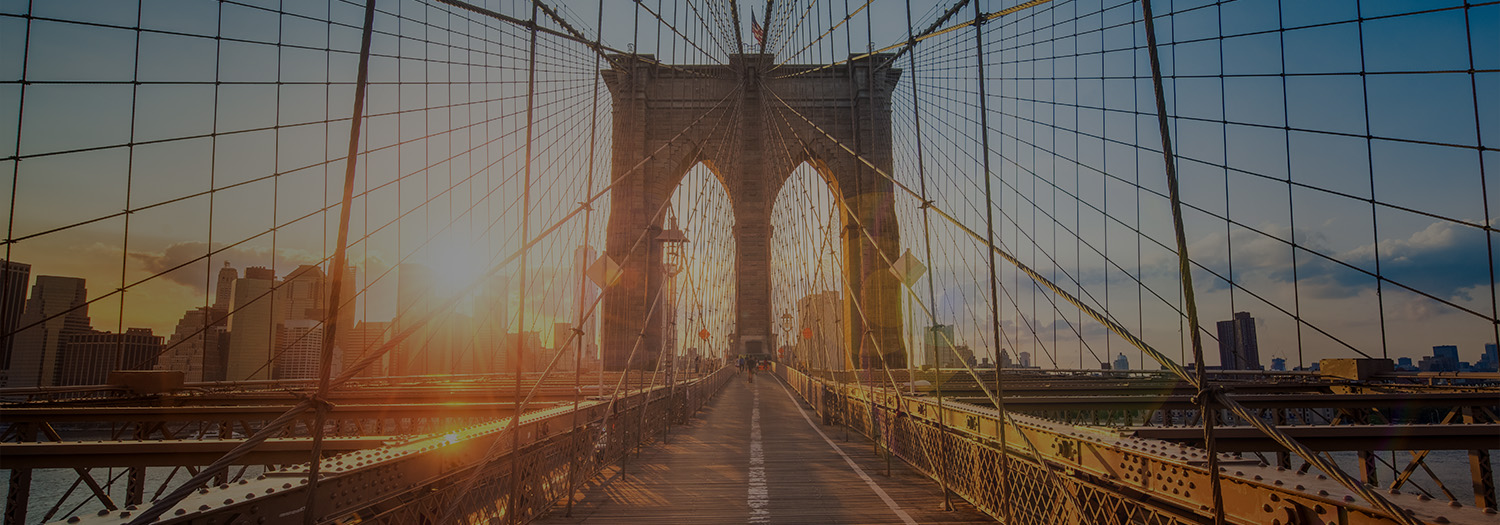 Brooklyn Bridge walkway at sunset