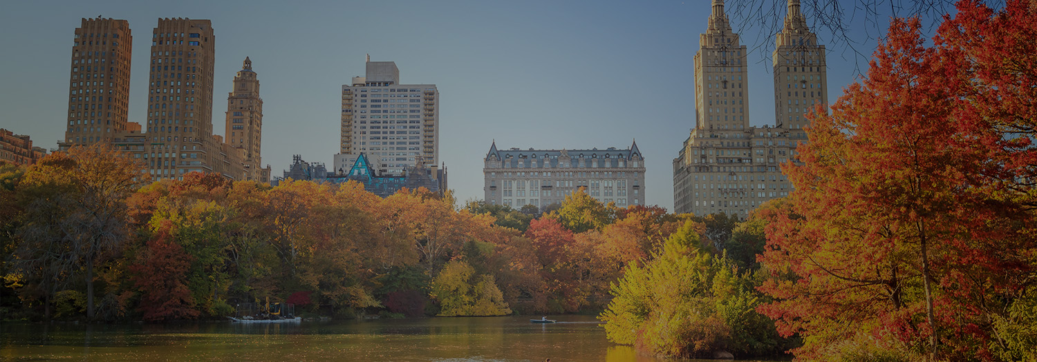 Central Park Lake with autumn foliage and Manhattan skyline