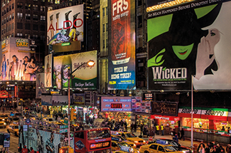Times Square at night with bright Broadway billboards