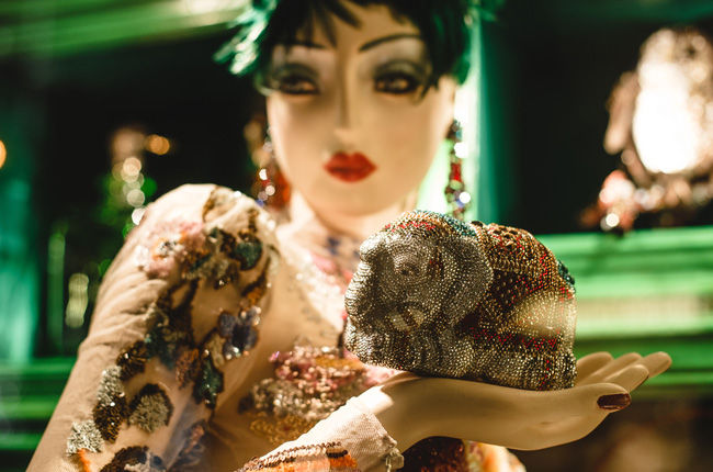 Glamorous mannequin with jeweled clutch in a holiday window display